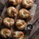 Salted pretzel knots on table in a row.