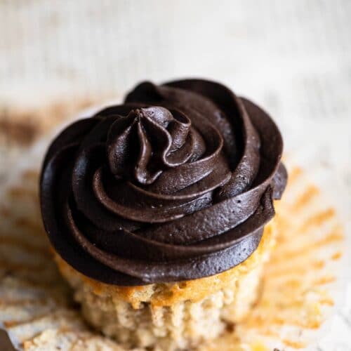 Closeup of a chocolate frosted cupcake.