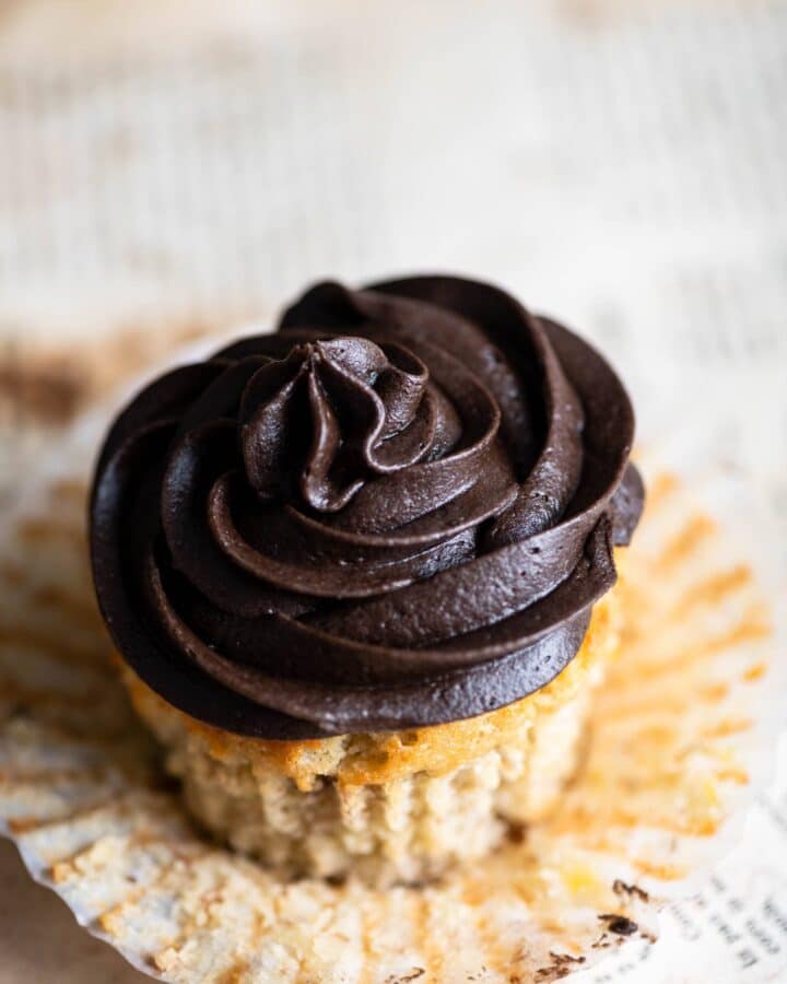 Closeup of a chocolate frosted cupcake.