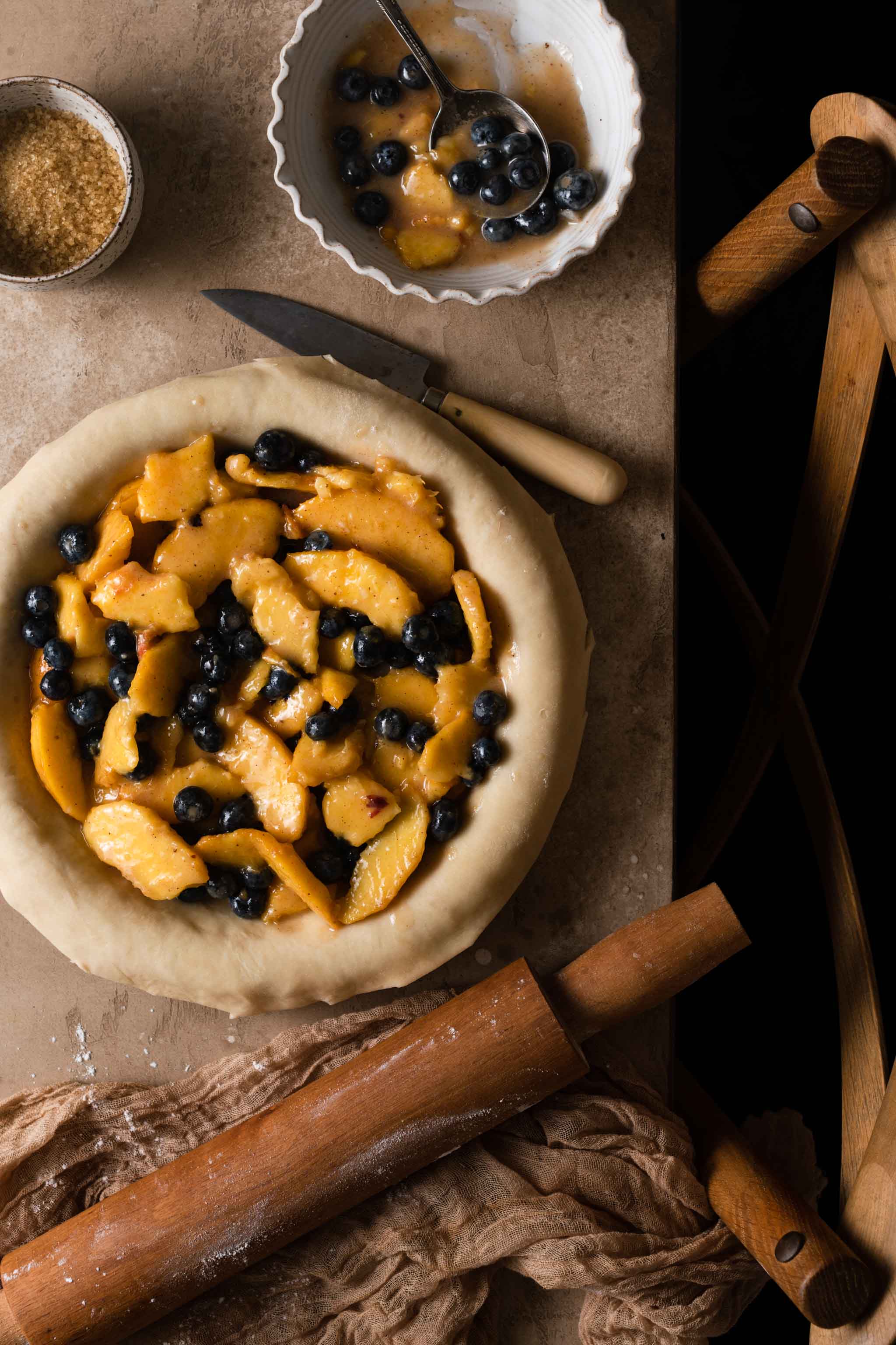 Peach and Blueberry Pie filling in a pie crust