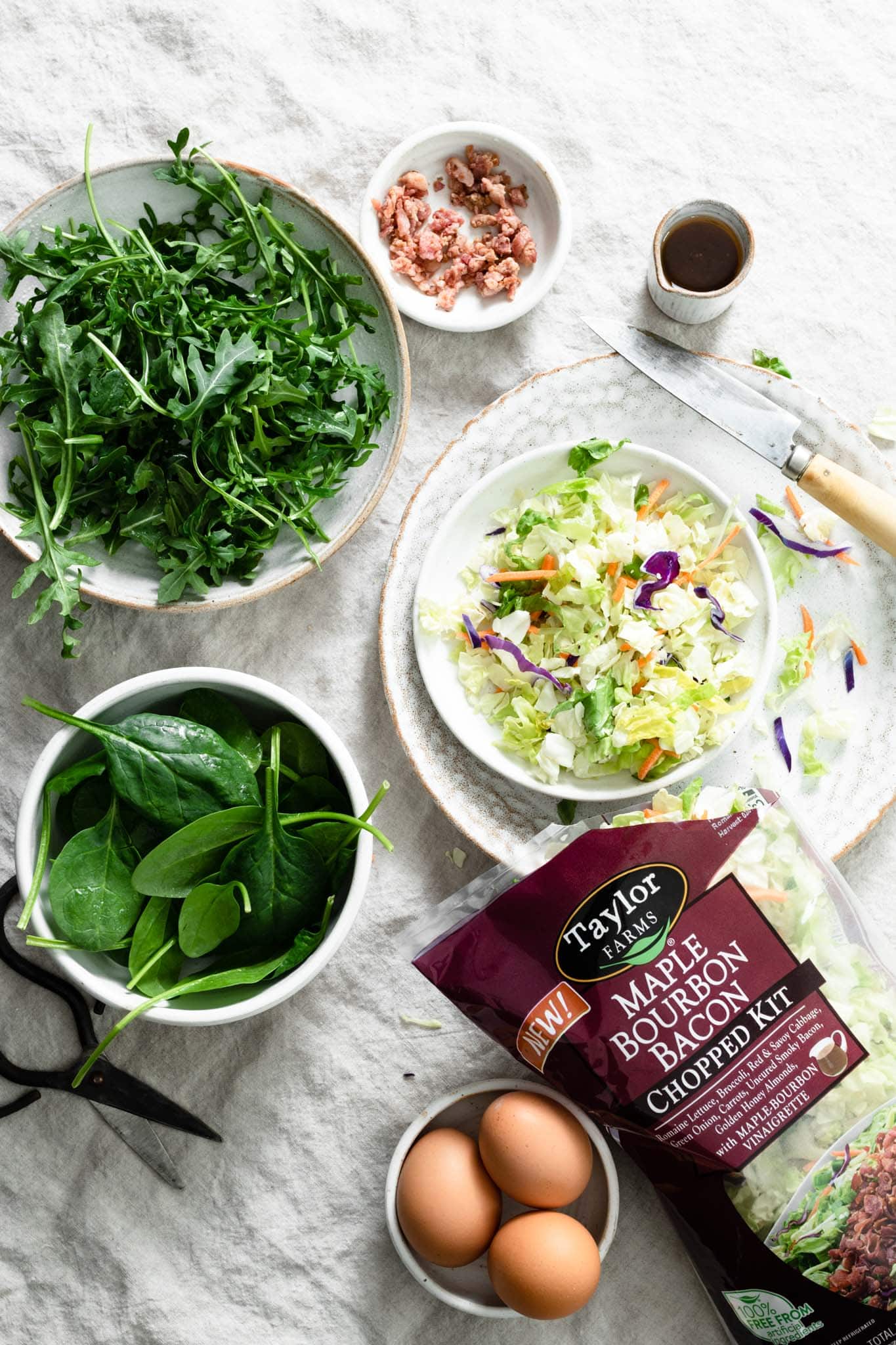 Taylor Farms fresh spinach, arugula, and salad kits for making quiche.