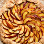 Overhead of a sliced peach galette tart.