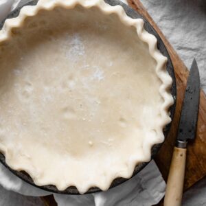 Homemade pie crust in a pie pan.