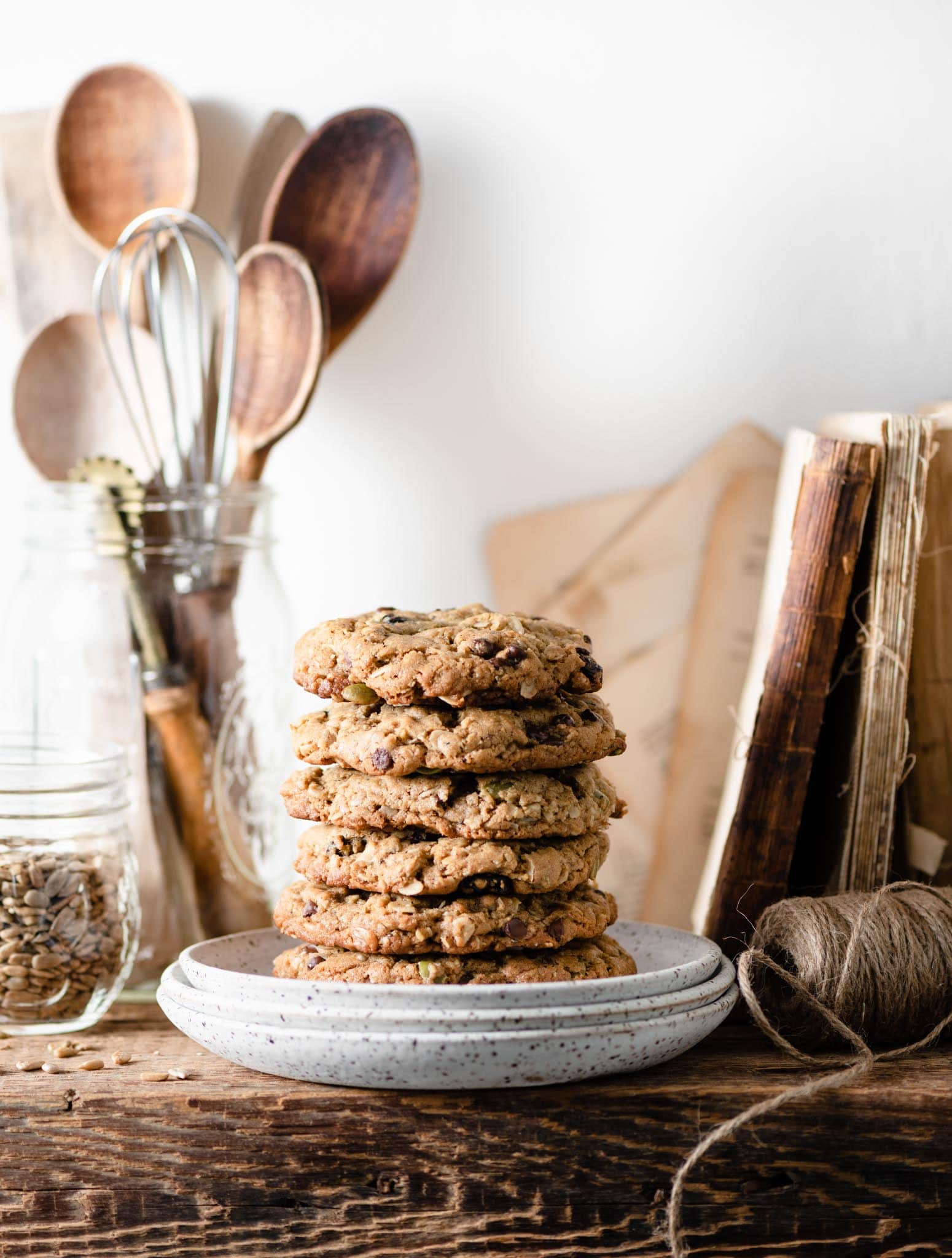 Stack of chewy oatmeal cookies on shelf.