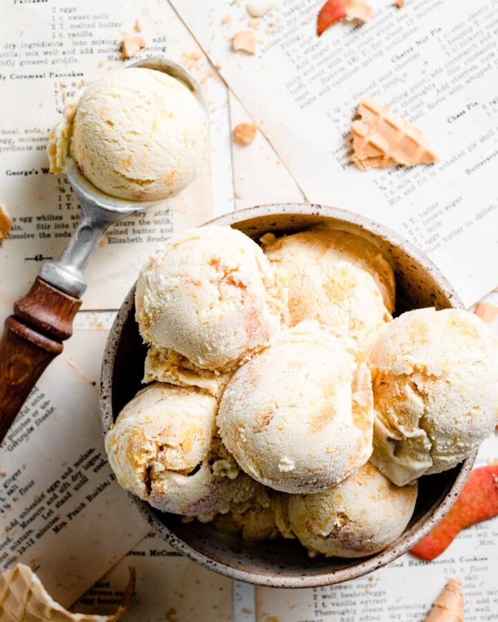 Scoops of peach ice cream in a bowl.
