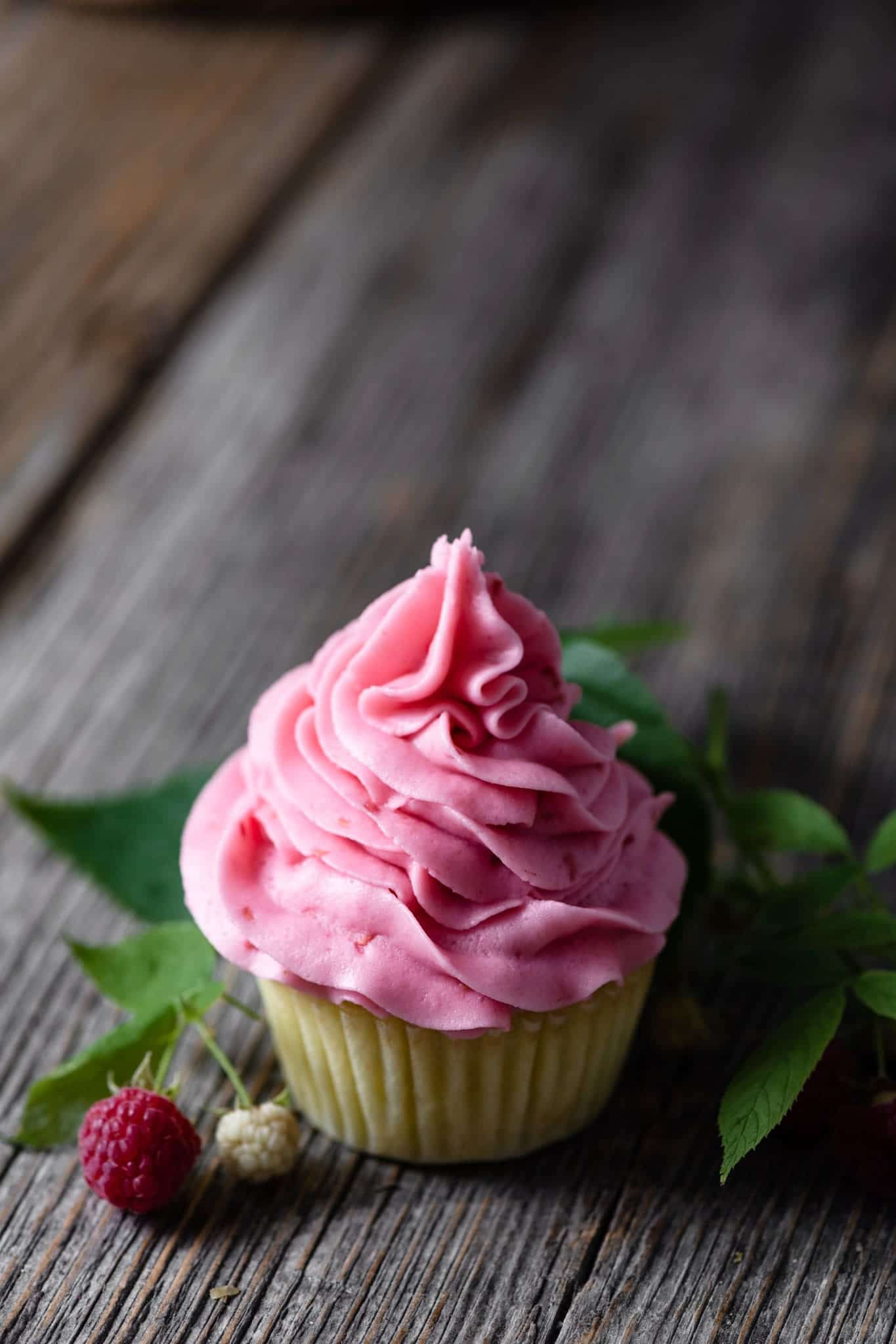 Pink frosted lemon cupcake.