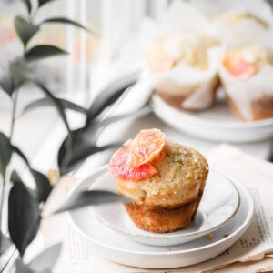 Muffin on a plate in the window.