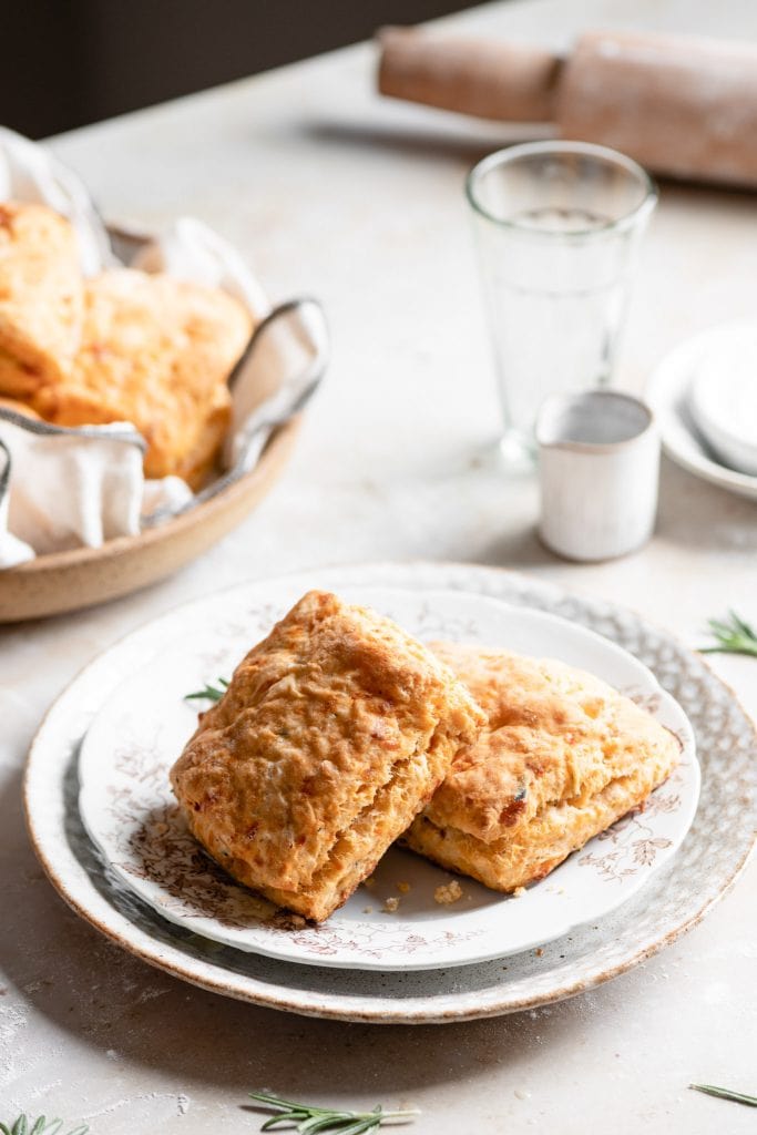 Biscuits on breakfast table with glasses.