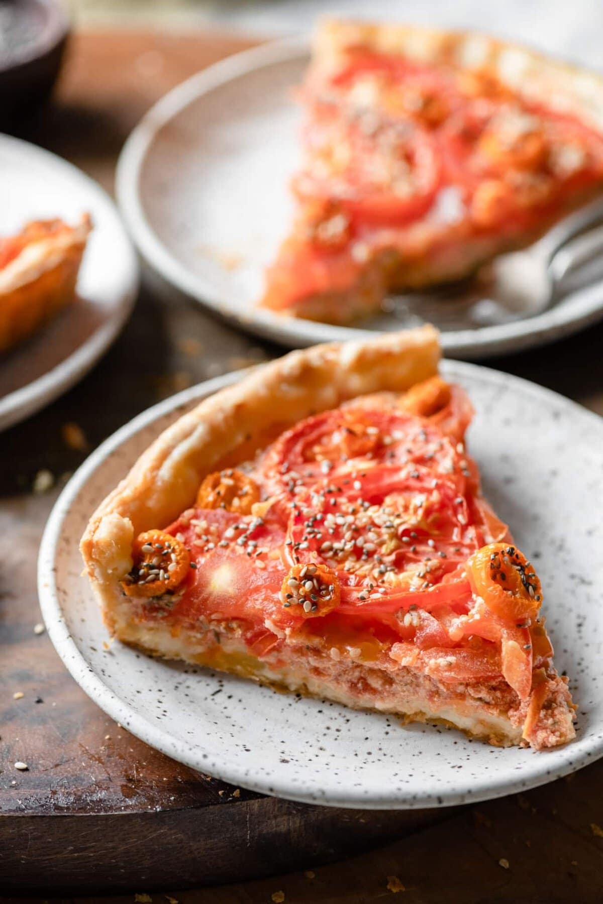 Closeup of a slice of tomato tart.
