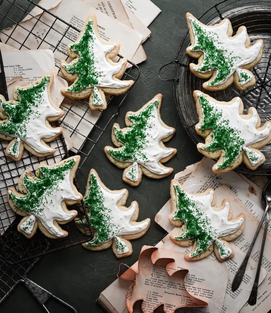 Green and white decorated tree shaped cookies on  recipe cards.