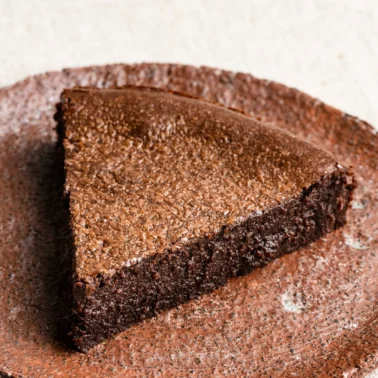 Slice of French chocolate cake on a plate.