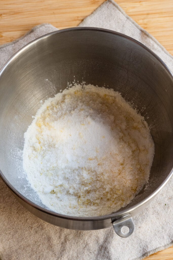 Flour and sugar in the bowl of a stand mixer.