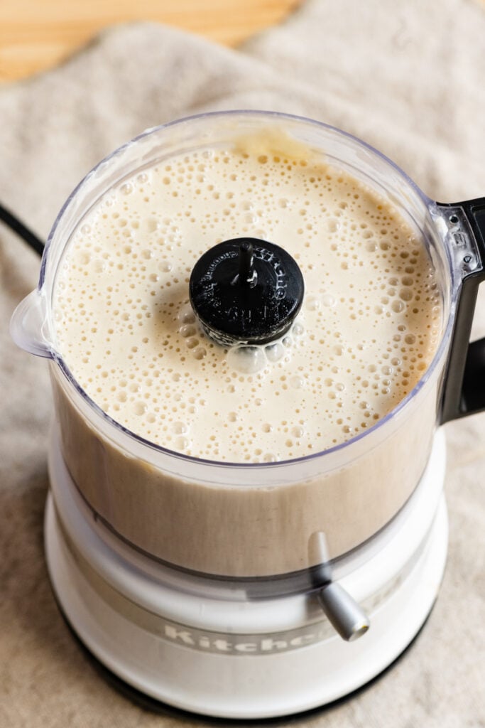 Liquid banana cake batter in a food processor.