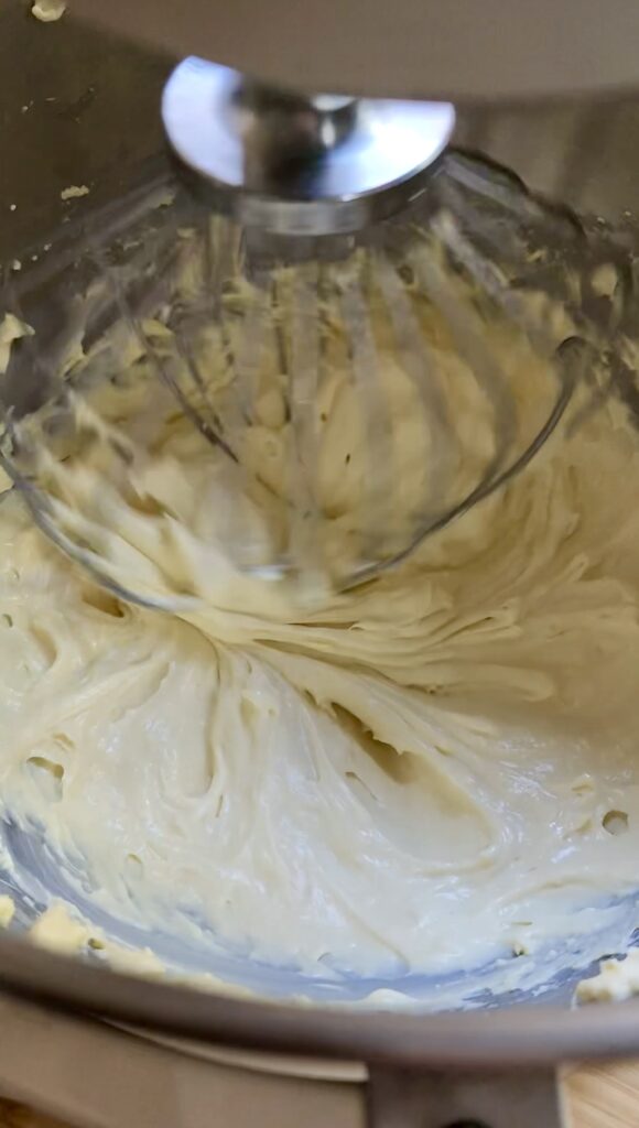Banana cremeux being whipped in a mixing bowl.