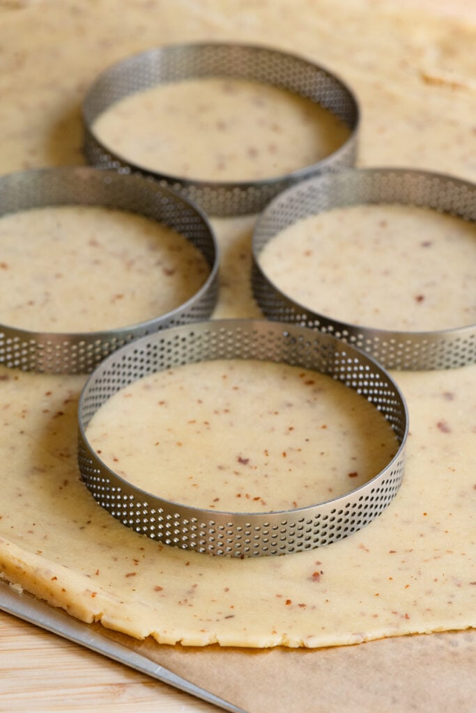 Tartlet pastry rings cutting out pate sucree dough.