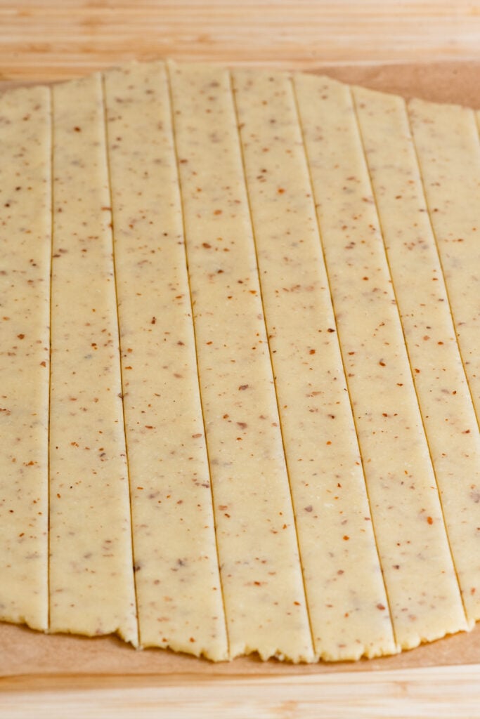 Tart dough rolled out and cut into strips.