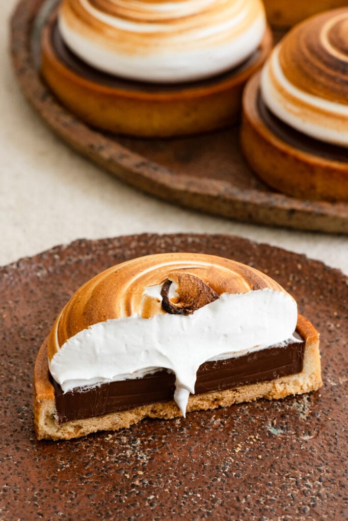 Half of a s'mores tart on a plate.