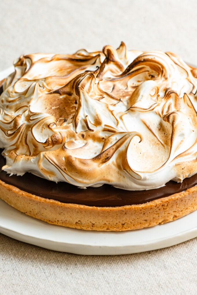 Up close of a toasted meringue chocolate tart.