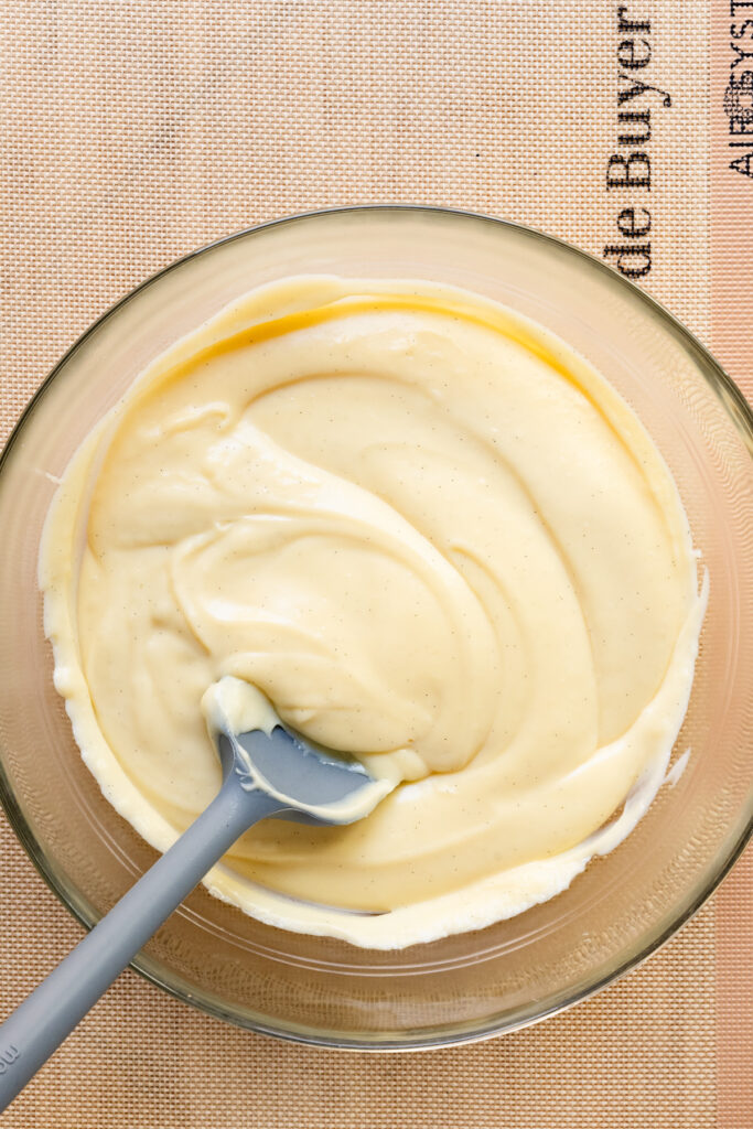 Overhead of a bowl filled with vanilla pastry cream.