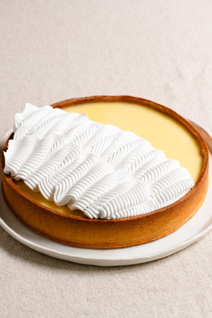 Lemon tart topped with piped Swiss meringue.